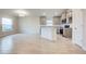 Open kitchen with gray cabinets, granite counters, and island at 6814 162Nd E Pl, Parrish, FL 34219
