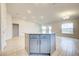 Kitchen island with granite countertop and gray cabinets at 6814 162Nd E Pl, Parrish, FL 34219