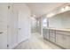 Elegant bathroom featuring double vanity, gray cabinets, and a large shower at 7018 162Nd E Pl, Parrish, FL 34219