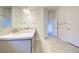 Double vanity bathroom with granite countertop and gray cabinets at 7018 162Nd E Pl, Parrish, FL 34219