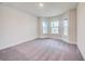 Spacious bedroom with gray carpeting and a bay window at 7018 162Nd E Pl, Parrish, FL 34219