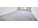 Simple bedroom with gray carpeting and a window at 7018 162Nd E Pl, Parrish, FL 34219