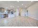 Open concept kitchen with gray cabinets and stainless steel appliances at 7018 162Nd E Pl, Parrish, FL 34219