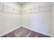 Large walk-in closet with wire shelving and gray carpeting at 7018 162Nd E Pl, Parrish, FL 34219