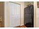 White pantry doors and black refrigerator in kitchen at 4207 S Dale Mabry Hwy # 8304, Tampa, FL 33611