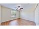 Spacious bedroom featuring wood floors and a ceiling fan at 11601 Mansfield Point Dr, Riverview, FL 33569