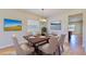 Bright dining room featuring a staged table setting and access to the living area at 11601 Mansfield Point Dr, Riverview, FL 33569