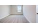 Well-lit bedroom with grey carpet and a large window at 16123 69Th E Ln, Parrish, FL 34219
