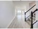 Bright entryway with tile flooring, staircase, and view to living room at 16123 69Th E Ln, Parrish, FL 34219