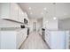 White kitchen with granite countertops and stainless steel appliances at 16123 69Th E Ln, Parrish, FL 34219