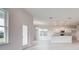 White kitchen with granite countertops and island at 16123 69Th E Ln, Parrish, FL 34219