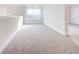 Spacious loft area with carpeted floor and window at 16123 69Th E Ln, Parrish, FL 34219