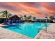 Resort-style community pool with a spacious deck and shaded seating areas at 6822 162Nd E Pl, Parrish, FL 34219