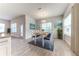 Bright dining room features a wooden table and blue chairs at 6822 162Nd E Pl, Parrish, FL 34219