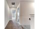 Upstairs hallway with carpeted floors and doors to bedrooms at 6822 162Nd E Pl, Parrish, FL 34219