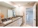 Double vanity bathroom with granite countertop at 5429 Blue Azure Dr, Wimauma, FL 33598