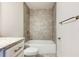 Bathroom with granite countertop, toilet, and bathtub at 6931 162Nd E Pl, Parrish, FL 34219