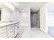 Double vanity bathroom with granite countertop and shower at 6931 162Nd E Pl, Parrish, FL 34219