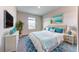 Main bedroom with bed, window, and dresser at 6931 162Nd E Pl, Parrish, FL 34219