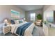 Main bedroom with king bed, coastal decor, and sitting area at 6931 162Nd E Pl, Parrish, FL 34219