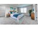 King-size bed, window, and dresser in a well lit bedroom at 6931 162Nd E Pl, Parrish, FL 34219