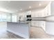 Modern kitchen with white cabinets and granite countertops at 6931 162Nd E Pl, Parrish, FL 34219