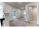 Upstairs hallway with carpeted floors and access to bedrooms at 6931 162Nd E Pl, Parrish, FL 34219