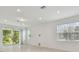 Open living space with neutral wall tones and abundant natural light at 1315 Kazaz Ct, Zephyrhills, FL 33541