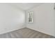 Simple bedroom with neutral wall and carpeting at 1279 Kazaz Ct, Zephyrhills, FL 33540