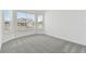 Bright bedroom with neutral carpeting and large window at 1279 Kazaz Ct, Zephyrhills, FL 33540