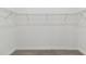 Walk-in closet with wire shelving and neutral carpeting at 1279 Kazaz Ct, Zephyrhills, FL 33540