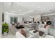 Open living room showcasing a spacious layout, neutral color palette, and ample natural light at 1279 Kazaz Ct, Zephyrhills, FL 33540