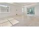 Spacious living room with tile floors and sliding glass doors leading to the outdoors at 1279 Kazaz Ct, Zephyrhills, FL 33540