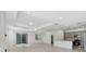 Bright and airy living area with open floor plan and kitchen island view at 1279 Kazaz Ct, Zephyrhills, FL 33540