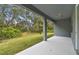 Covered patio overlooking a grassy backyard at 1285 Kazaz Ct, Zephyrhills, FL 33540