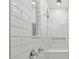 Clean shower with subway tile and built-in bench at 1285 Kazaz Ct, Zephyrhills, FL 33540