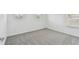Bright bedroom featuring grey carpet and window at 1244 Kazaz Ct, Zephyrhills, FL 33540
