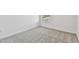 Bright bedroom with grey carpet and window at 1244 Kazaz Ct, Zephyrhills, FL 33540