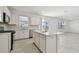 Open concept kitchen with island and stainless steel appliances at 1244 Kazaz Ct, Zephyrhills, FL 33540