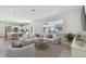 Bright living room with open floor plan and adjacent kitchen at 1244 Kazaz Ct, Zephyrhills, FL 33540