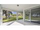 Covered patio with sliding glass doors and a view of the backyard at 37886 Clinch Cir, Zephyrhills, FL 33540