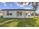 Covered patio with grassy backyard at 37886 Clinch Cir, Zephyrhills, FL 33540