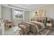 Spacious bedroom with large bed, neutral decor, and natural light at 37886 Clinch Cir, Zephyrhills, FL 33540