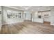 Open concept kitchen with white cabinets and an island at 37886 Clinch Cir, Zephyrhills, FL 33540