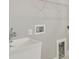 Laundry room with utility sink and built-in shelving at 37886 Clinch Cir, Zephyrhills, FL 33540