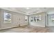Bright living room featuring hardwood floors and large windows at 37886 Clinch Cir, Zephyrhills, FL 33540