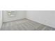 Bright bedroom with grey carpet and window at 1209 Kistna Dr, Zephyrhills, FL 33540