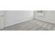 Simple bedroom with grey carpet and window at 1209 Kistna Dr, Zephyrhills, FL 33540