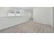 Upstairs bedroom with gray carpeting and neutral walls at 1209 Kistna Dr, Zephyrhills, FL 33540