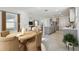 Open concept kitchen features island, stainless steel appliances, and grey cabinets at 1209 Kistna Dr, Zephyrhills, FL 33540